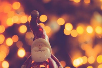 red and white ceramic santa claus figurine